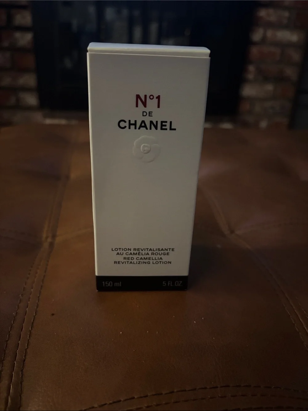 CHANEL N°1 Revitalizing Lotion — White Bottle with Black Cap and Red Accent